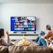 Watch iron iptv with family enjoying a vibrant smart TV experience in a cozy living room.