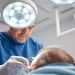 Surgeon conducting a hair transplant procedure with precision in a modern clinic.