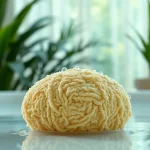 Experience the best back loofah for dry skin showcasing its unique texture in a serene bath setting.